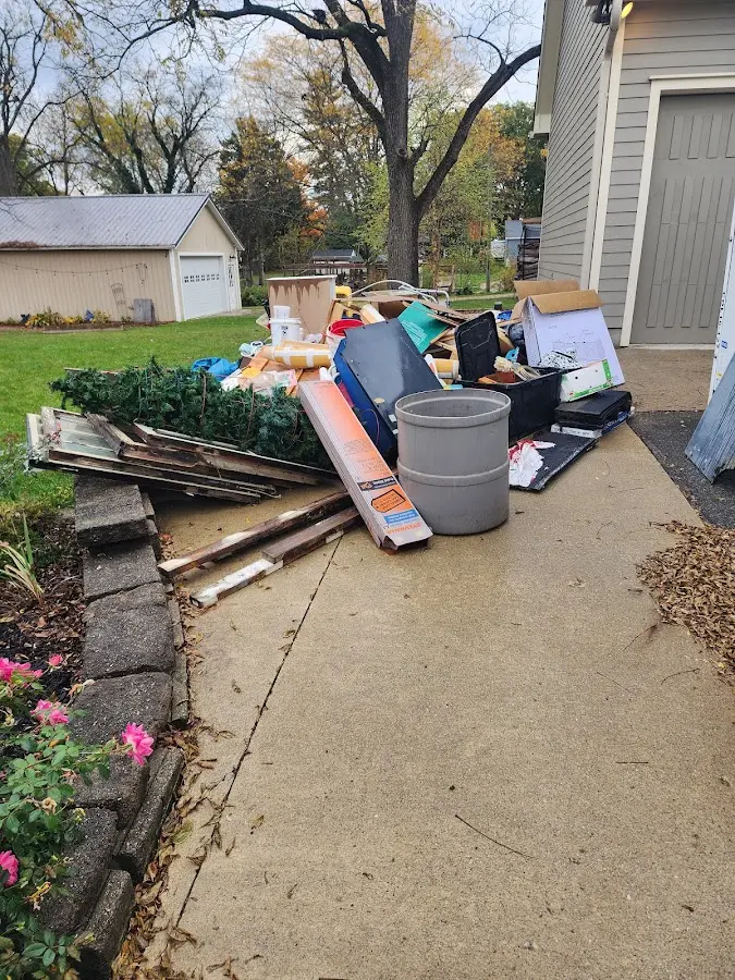 Dumpster being loaded with debris for Commercial Dumpster Rental in North Lakeport